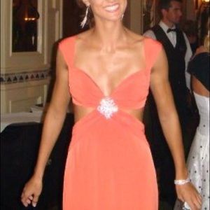 Orange cut out gown with broach